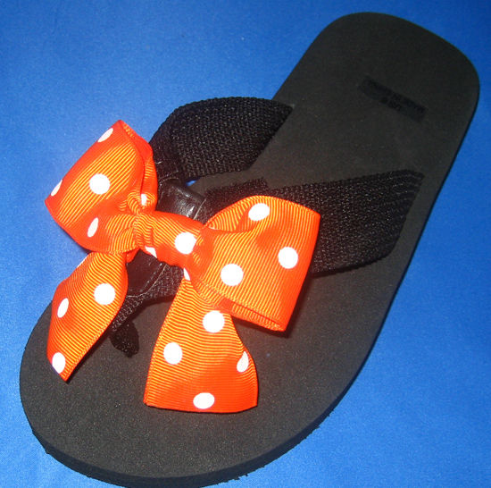 Orange with White Polka dots child's flip flop.